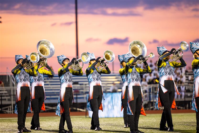 Students perform on football field